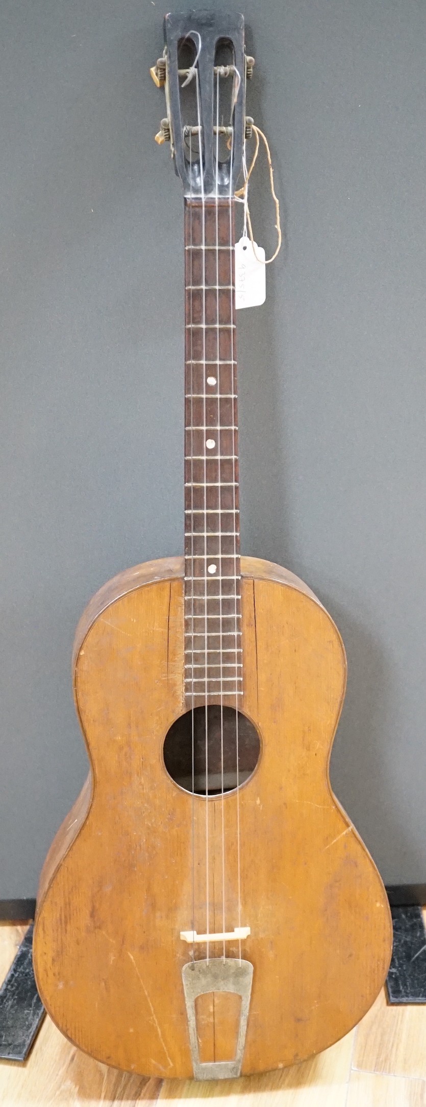 A four string banjo style parlour guitar